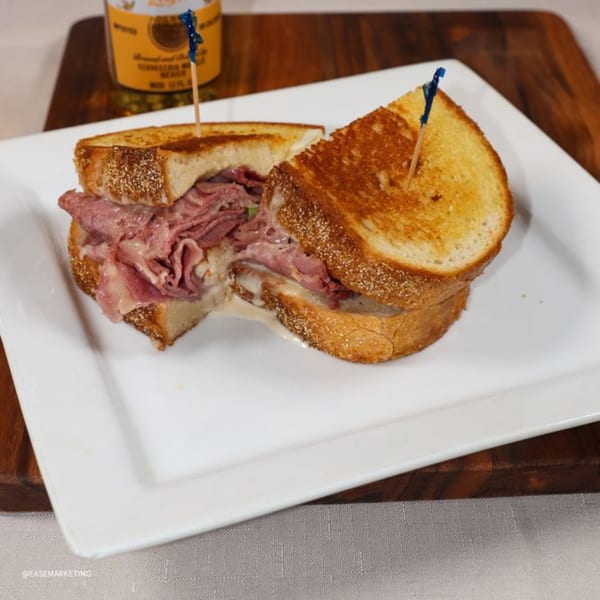 A Prime 7 Bar & Restaurant Reuben sandwich with corned beef, Swiss cheese, and sauerkraut on toasted rye.